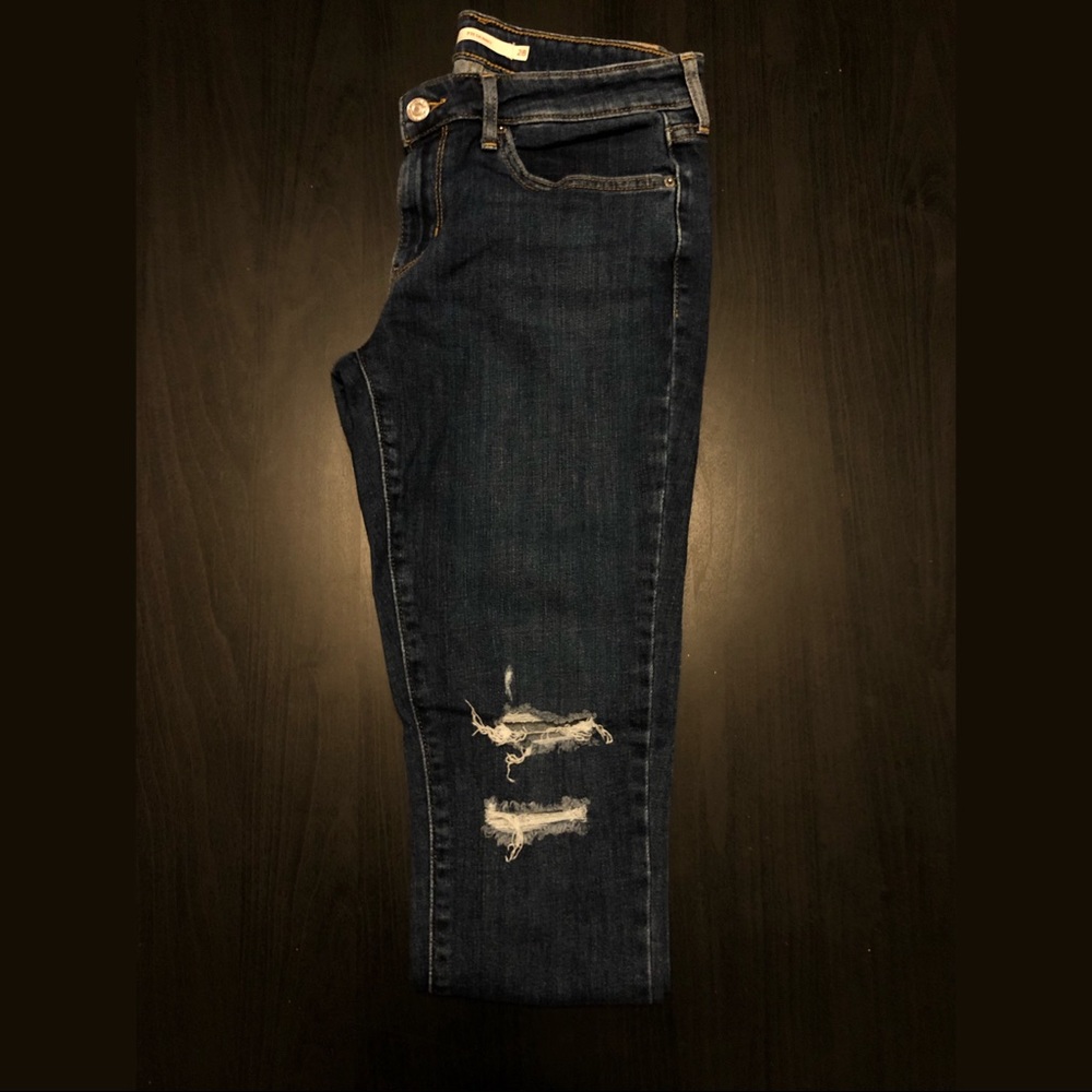 Levi’s 711 dark blue ripped jeans